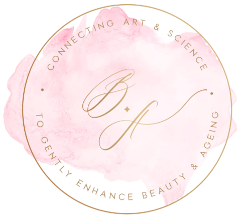 Logo with pink watercolor background and gold text on a white background